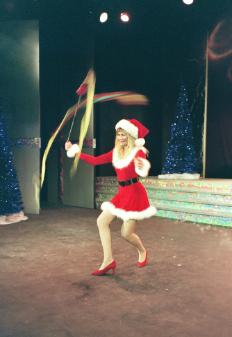 Santa Girl spinning poi ribbons