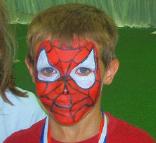 boy with face painted as Spiderman